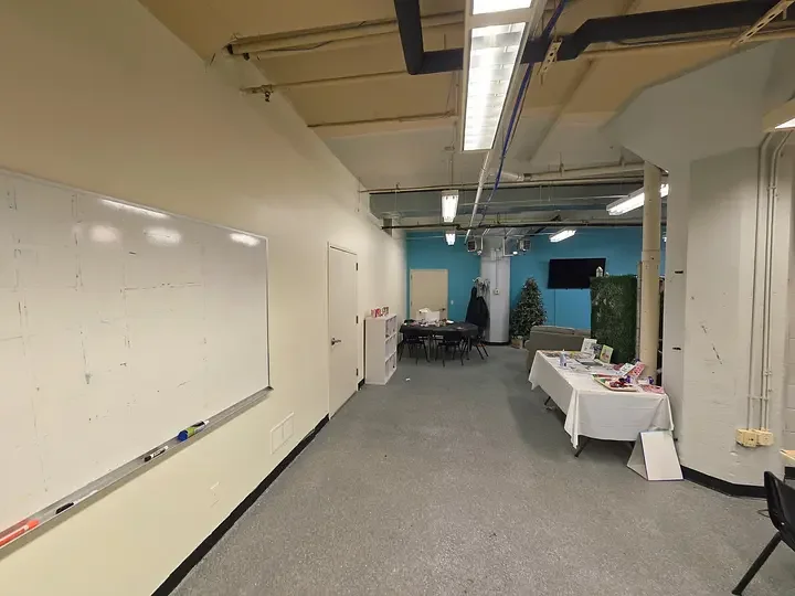 Freshly painted commercial interior with white walls and a blue accent wall