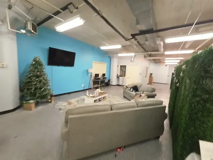 Freshly painted commercial lounge space with a blue accent wall