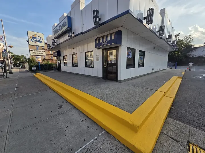 Freshly painted white and navy commercial building exterior with crisp trim lines